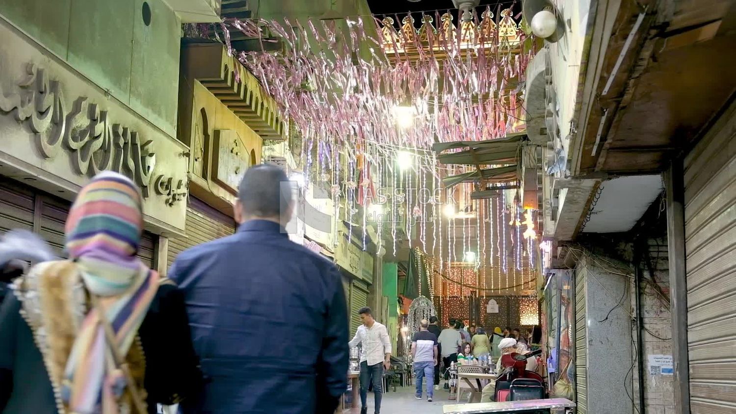 People sitting in a street coffee shop, Ramadan
