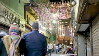 People sitting in a street coffee shop, Ramadan