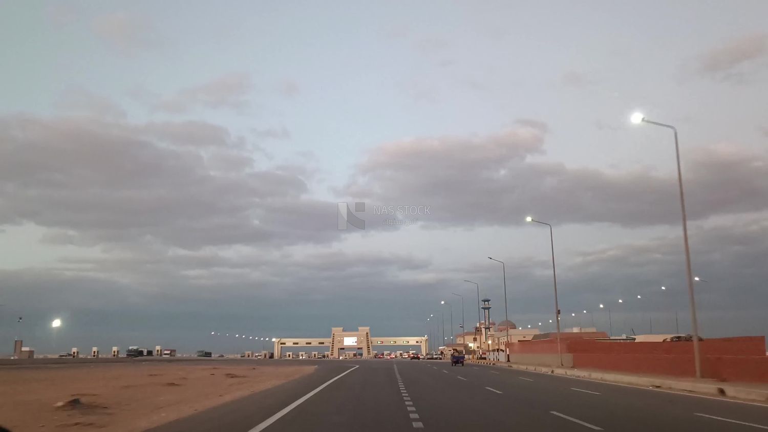 Video from inside a car traveling on the desert road reaching the gates of Cairo