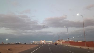 Video from inside a car traveling on the desert road reaching the gates of Cairo