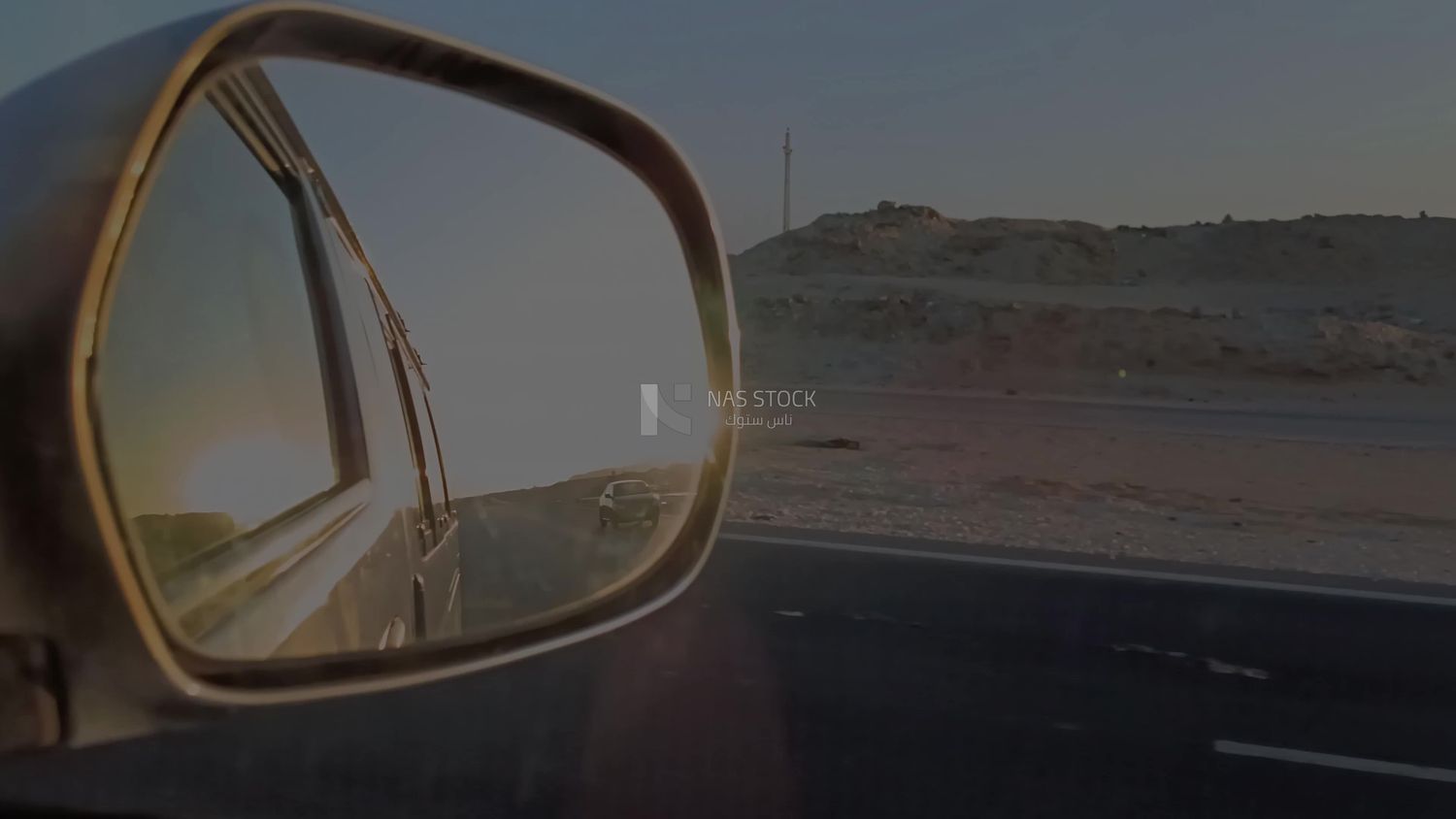 Video of a photographer riding a fast car on a desert road