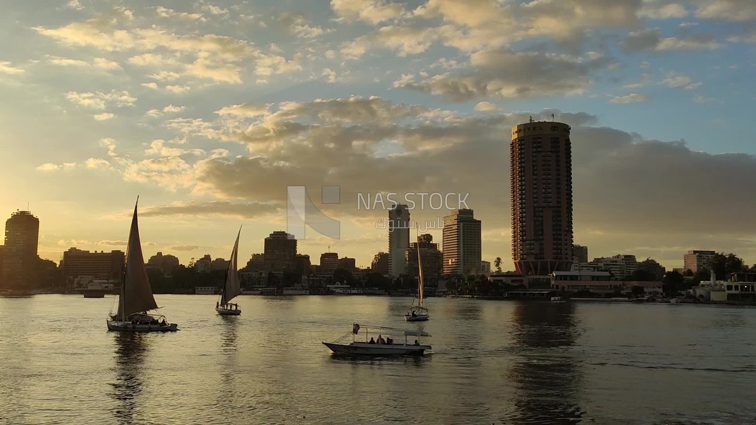 Video of landscape of the Sofitel El Gezirah hotel, as the Nile boats sail in front of it in a stunning view