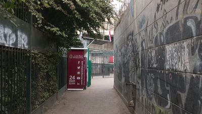 Video showing an ATM on the corner of a small side alley