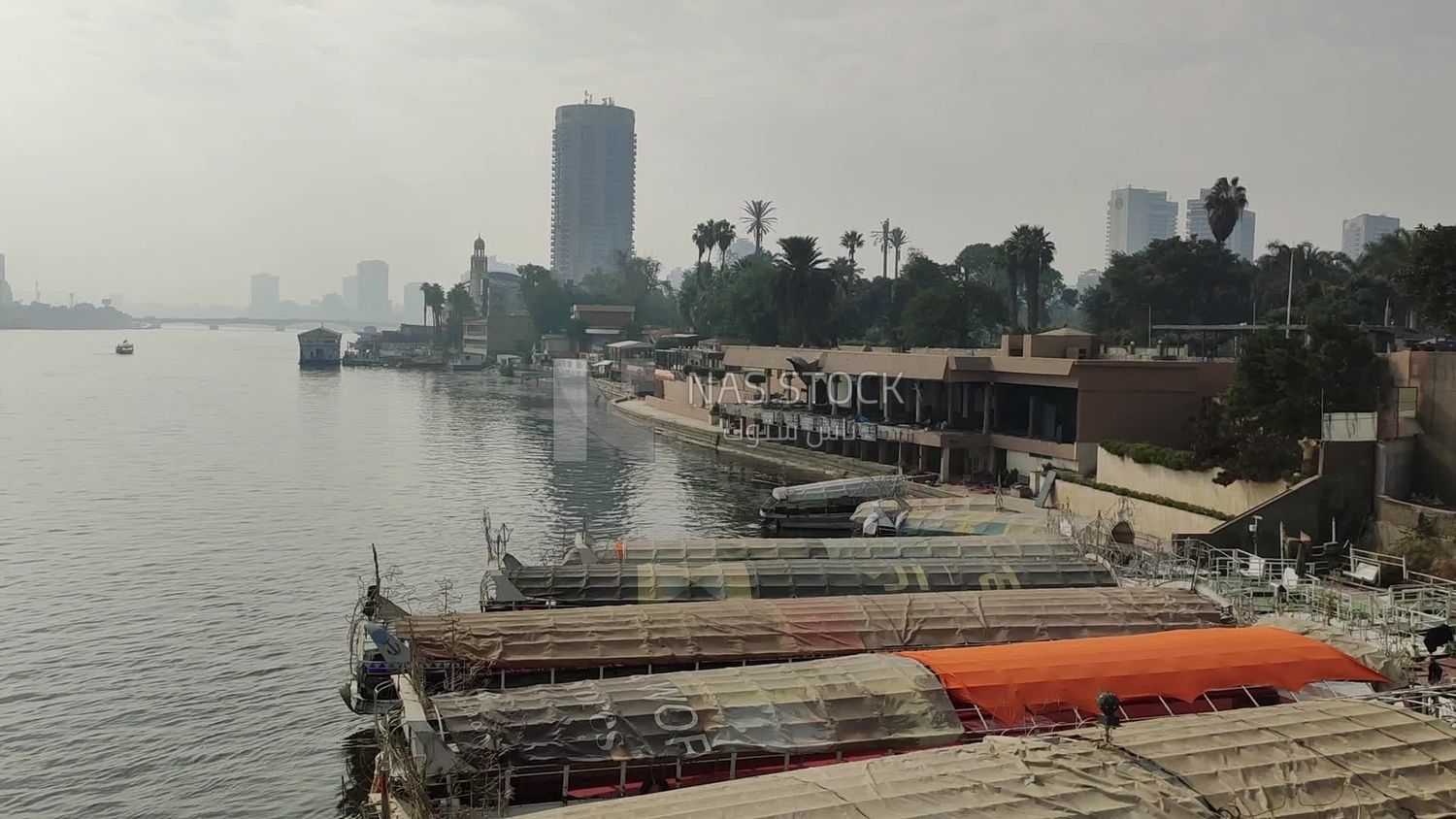 Video showing a group of traditional feluccas moored in the Nile River near the Sofitel El Gezirah Hotel