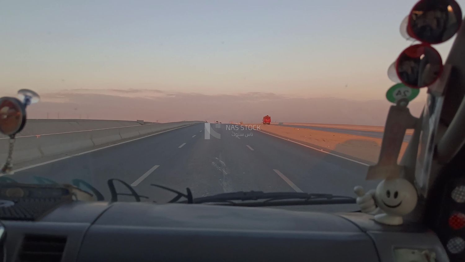 Video of a photographer riding a taxi traveling on the desert road