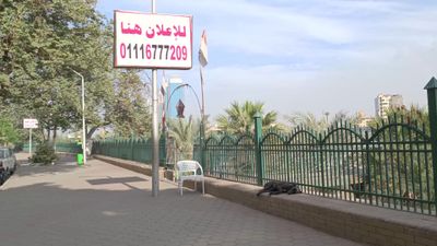 Video showing the pedestrian sidewalk overlooking the Nile River with lighting poles