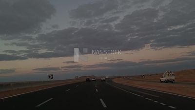 Video showing traveling on the desert road with a stunning view of the sunset