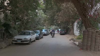 Video showing a street in Maadi where pedestrians and motorbikes roam