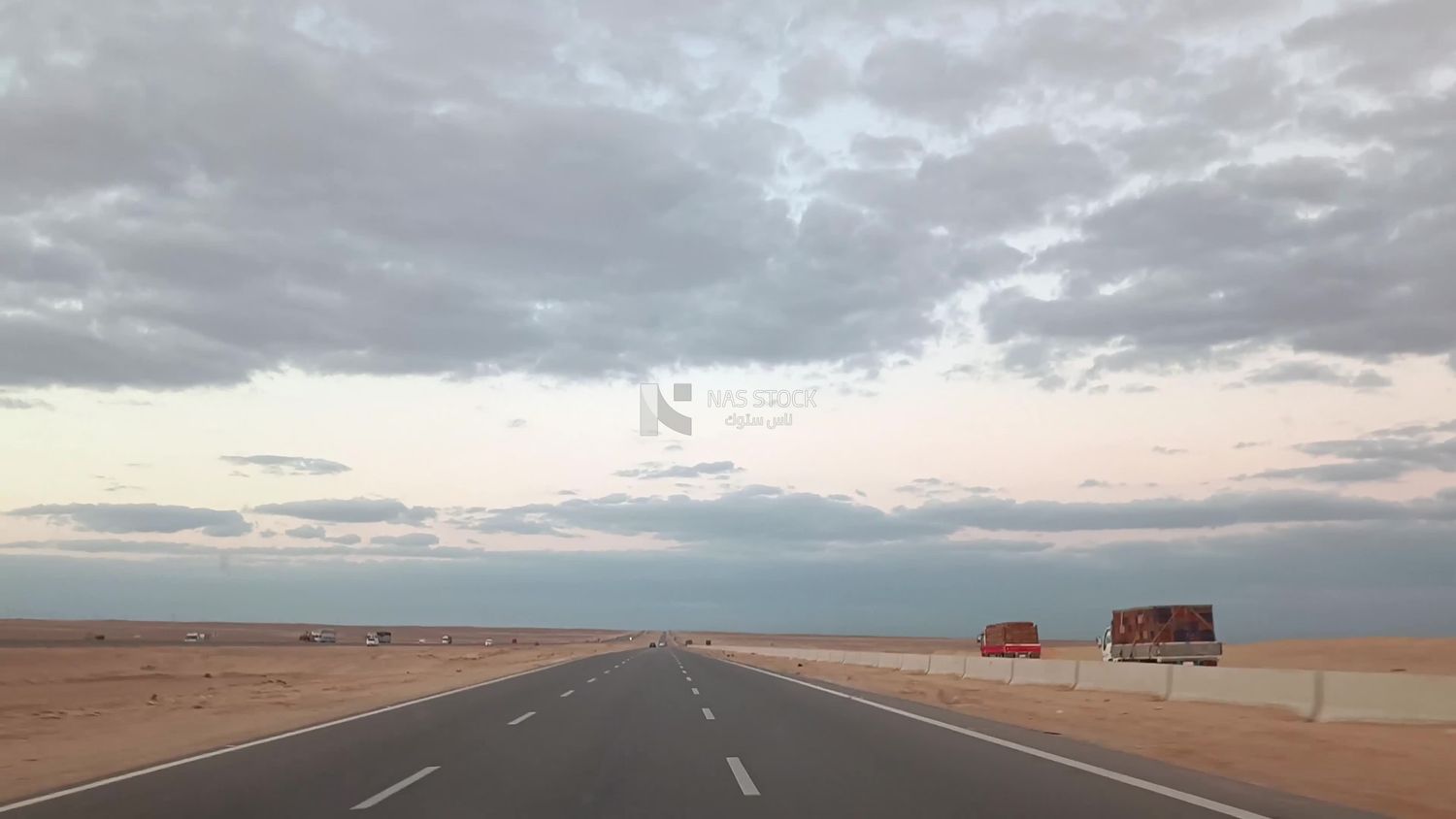 Video showing traveling on the desert road with a stunning view of the sky and clouds