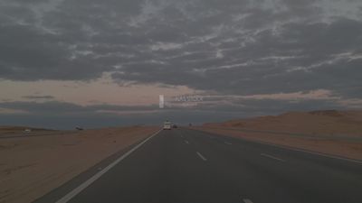 Video showing traveling on the desert road with a stunning view of the sunset