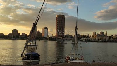 Landscape video of the Nile boats, some sailing and others mooring in the Nile River in front of the Sofitel Hotel