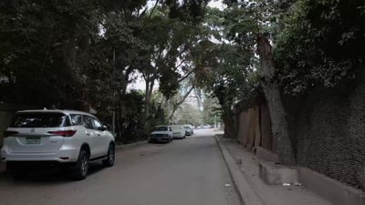 Video showing a camera roaming a quiet Cairo street