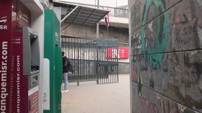 Video showing a camera walking down a side corridor and then exiting it
