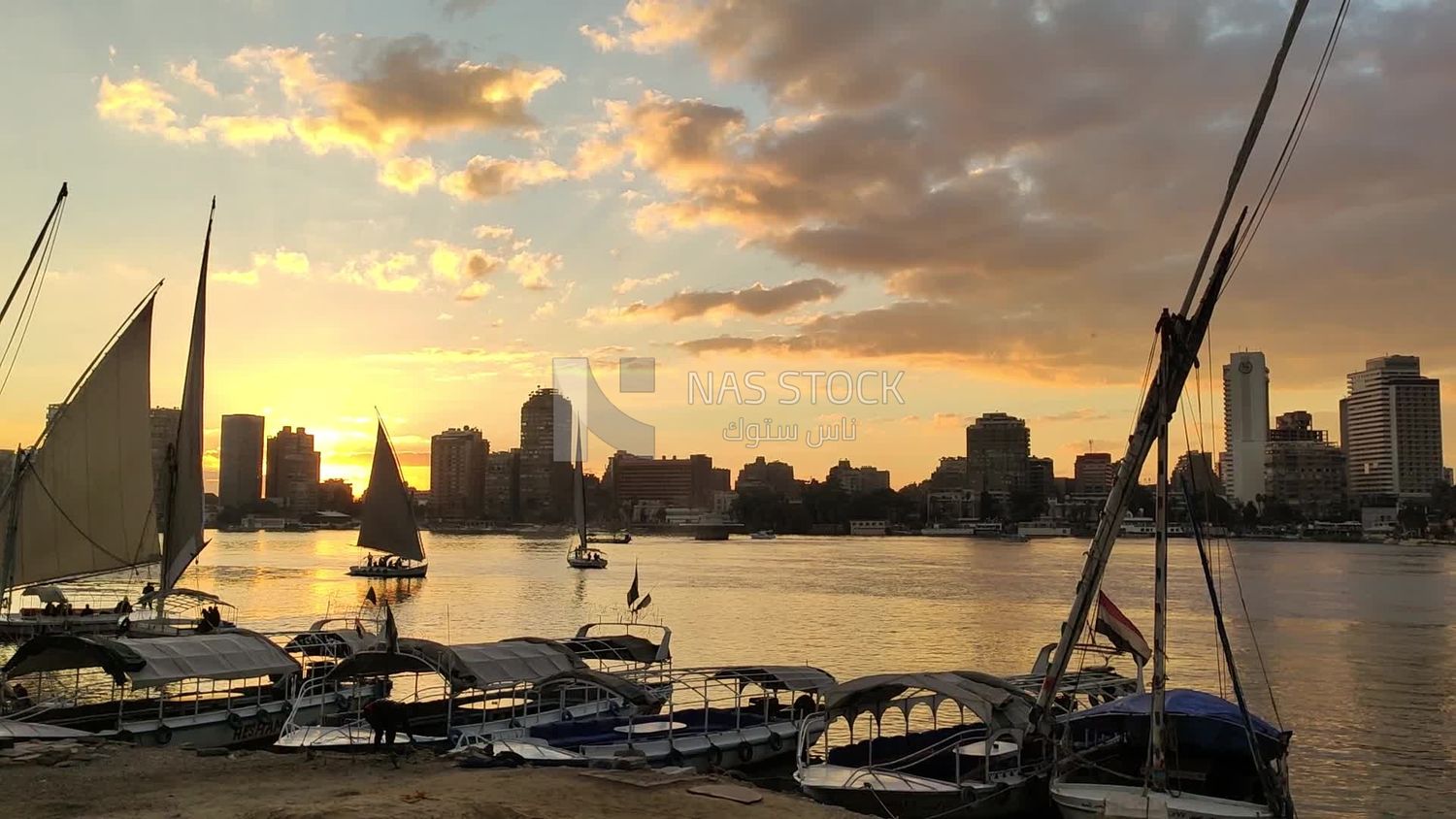 Video showing a stunning sunset view with the Nile River and Nile boats at anchor
