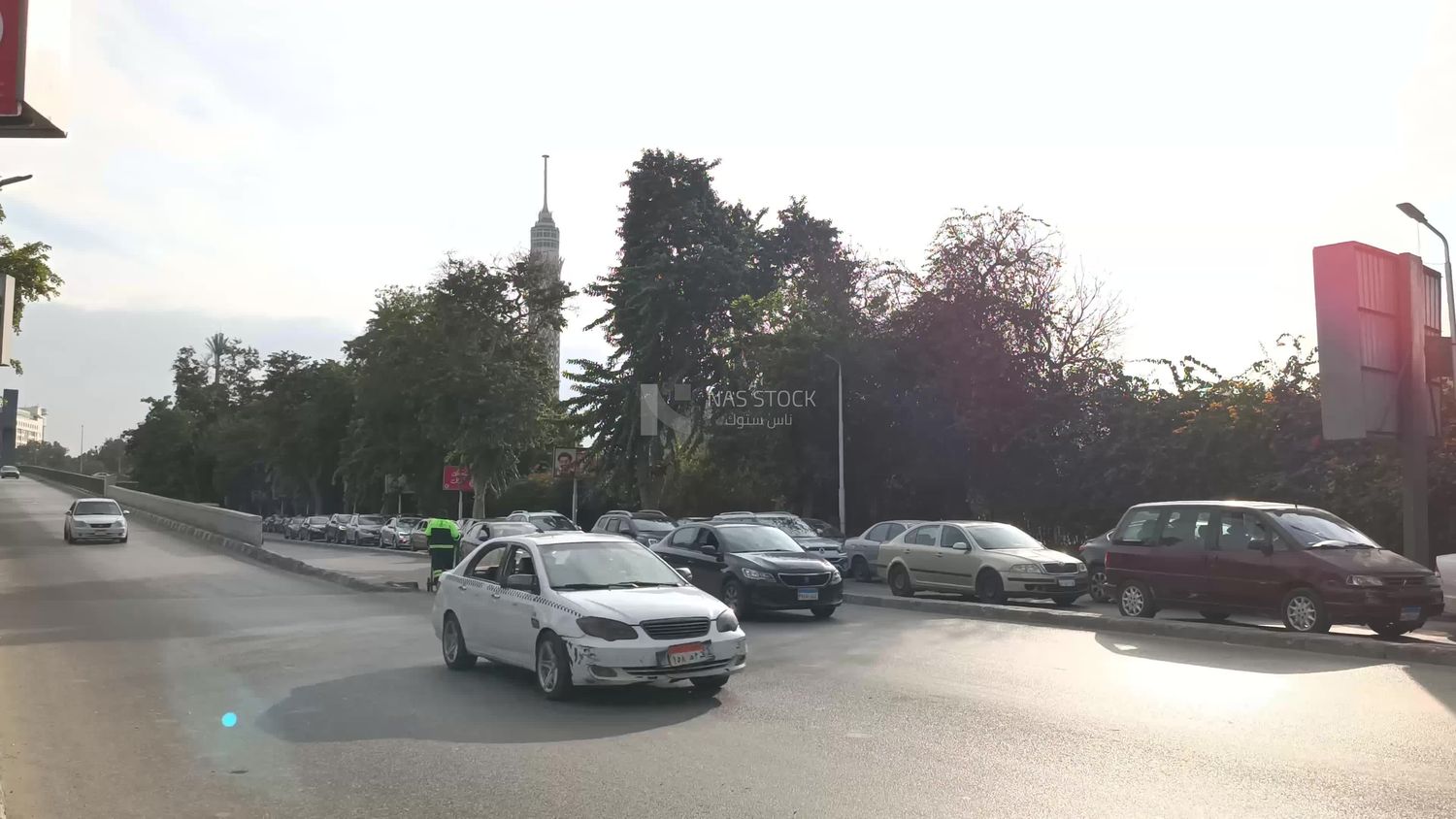 Video showing one of the wide streets of Zamalek in Cairo, where cars are moving quickly