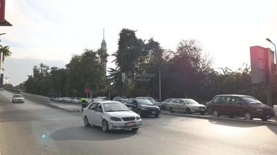 Video showing one of the wide streets of Zamalek in Cairo, where cars are moving quickly