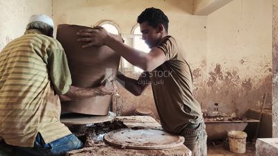 Craftsmen working in a pottery workshop