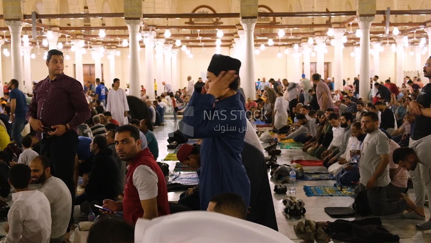 Worshipers praying in a mosque, performing the obligatory prayer in the mosque, worship and draw close to God