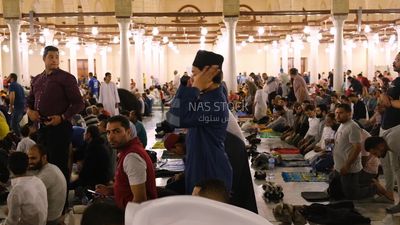 Worshipers praying in a mosque, performing the obligatory prayer in the mosque, worship and draw close to God