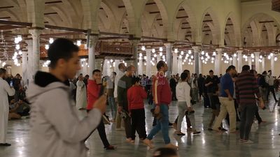 Worshipers praying in a mosque, performing the obligatory prayer in the mosque, worship and draw close to God