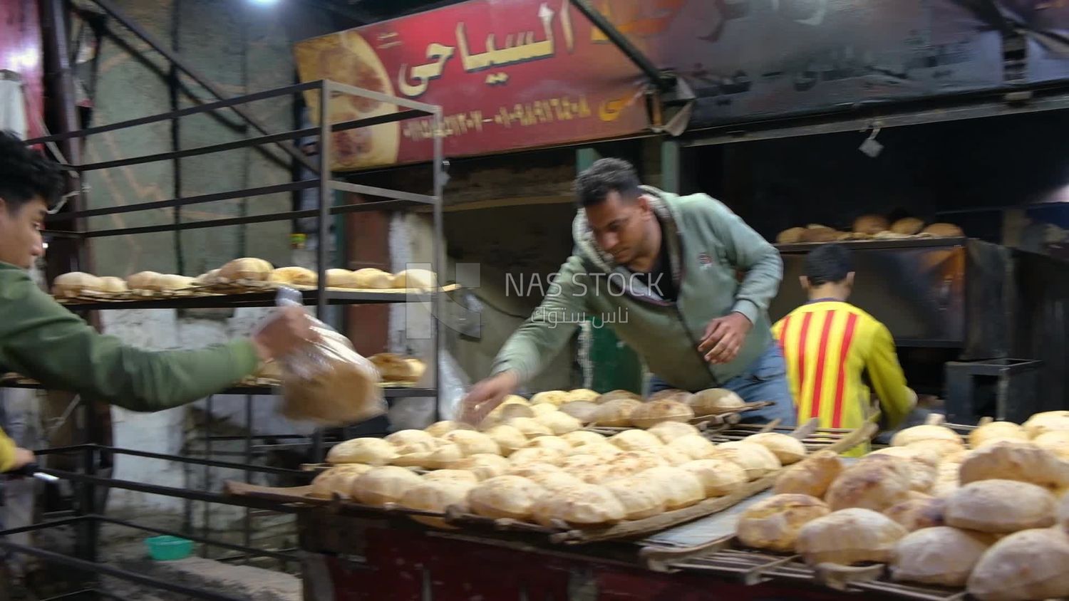 Man selling baladi bread, street, work