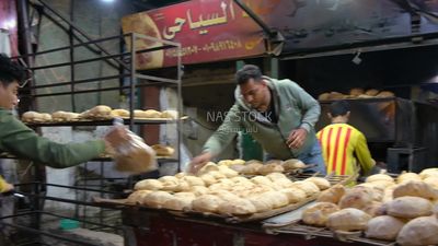 Man selling baladi bread, street, work