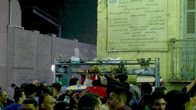 Man standing in a street restaurant, traditional breakfast, street food