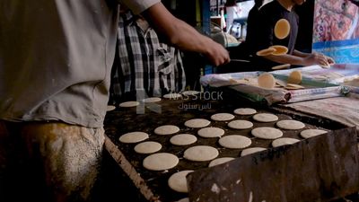 Man standing in qatayef store, Ramadan sweets, Ramadan kareem