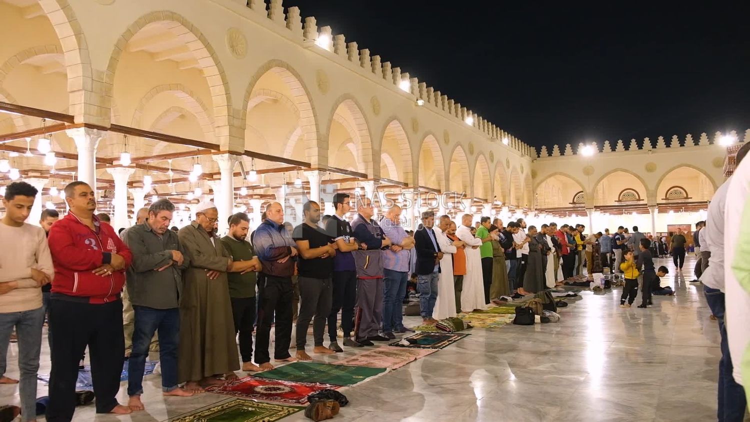 Worshipers praying in a mosque, performing the obligatory prayer in the mosque, worship and draw close to God