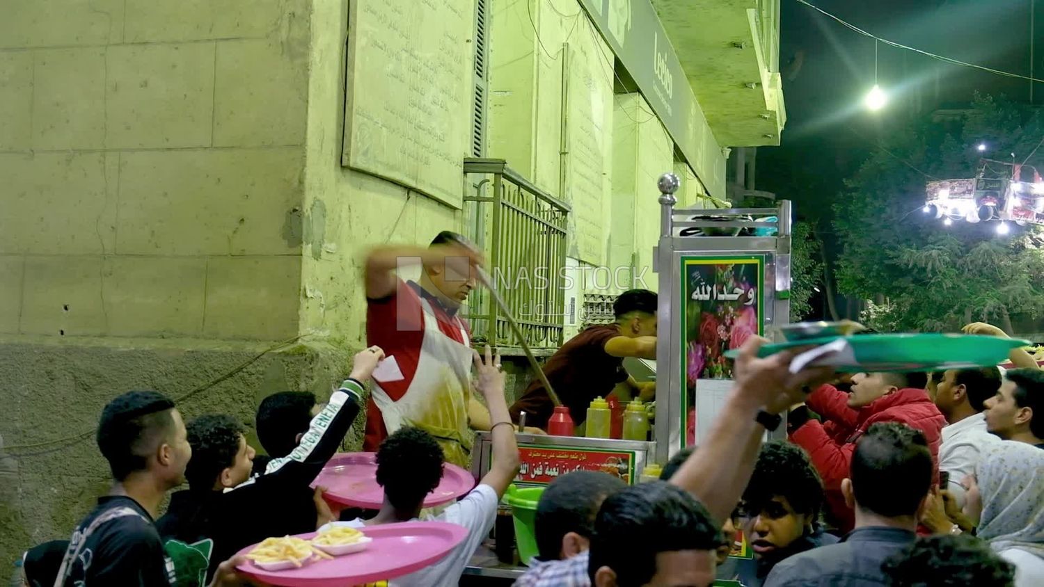 Man standing in a street restaurant, traditional breakfast, street food