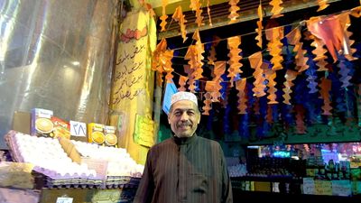 Man standing in egg store, street, Ramadan Kareem