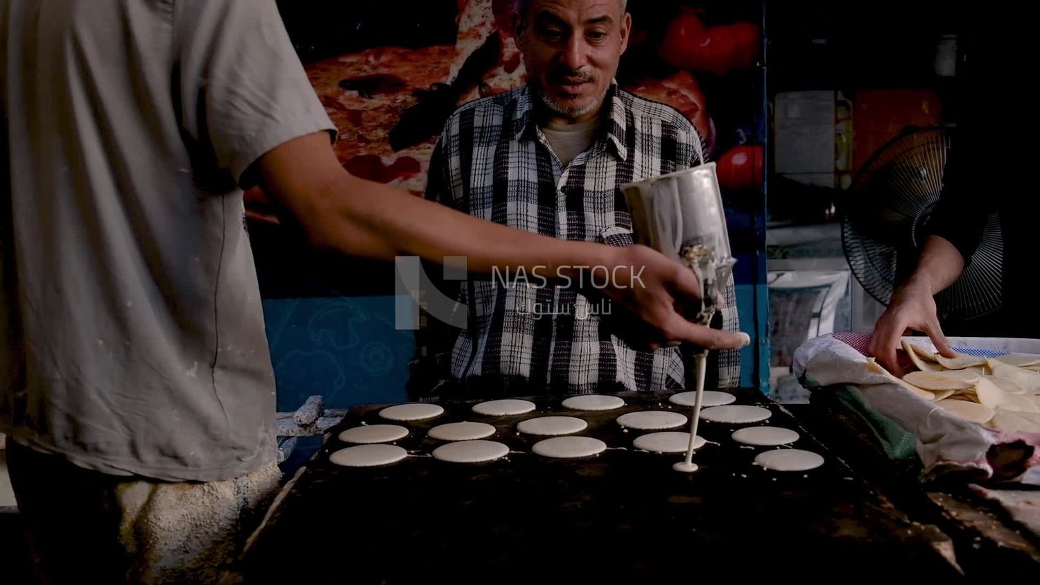 Man standing in qatayef store, Ramadan sweets, Ramadan kareem