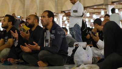 Worshipers praying in a mosque, performing the obligatory prayer in the mosque, worship and draw close to God