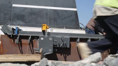 Group of engineers trying to put a part of a bridge to complete it, work, construction, engineering tools and equipment