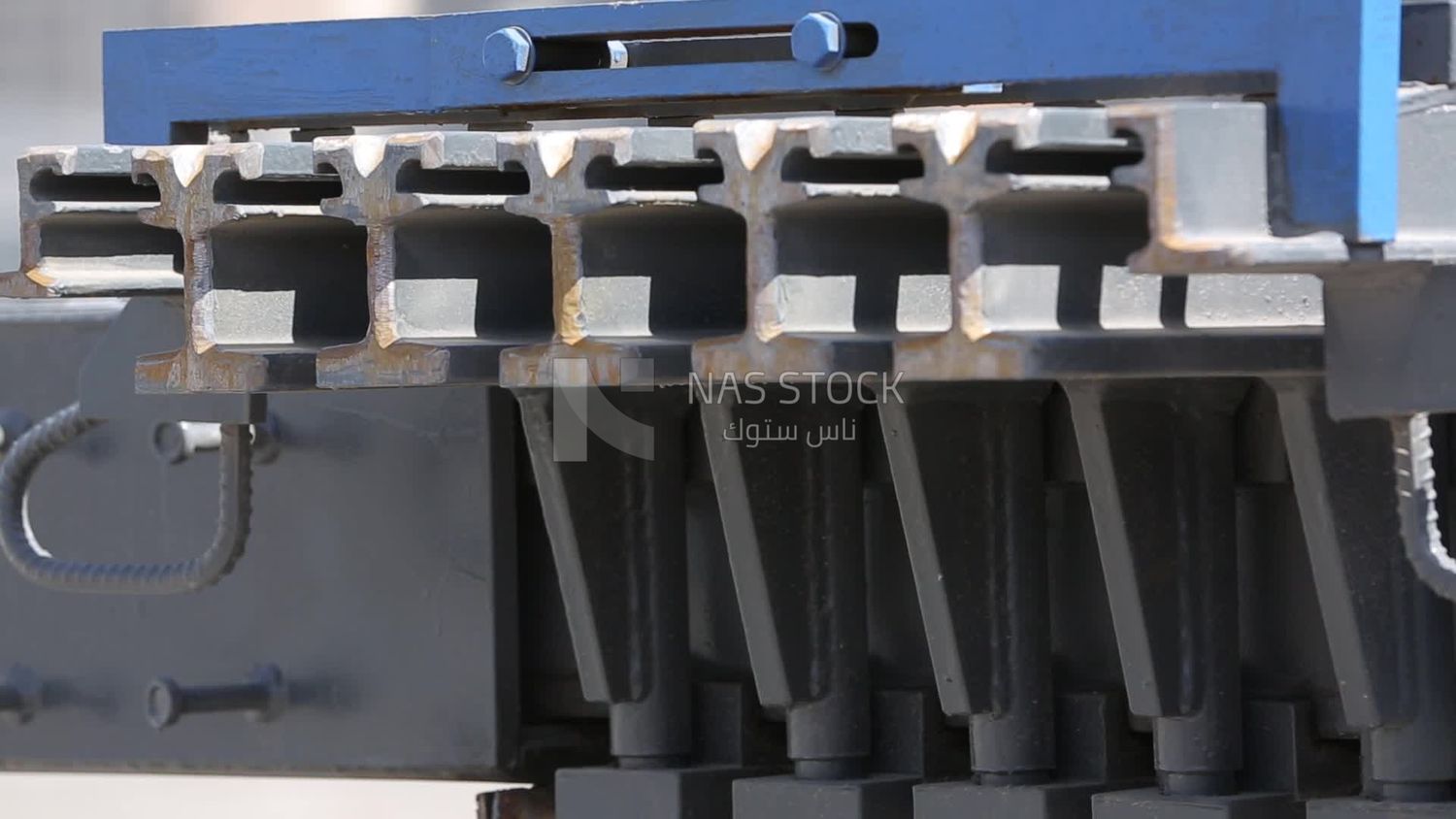 Two workers are trying to put the steel on a steel wire rope, work, construction, engineering tools and equipment