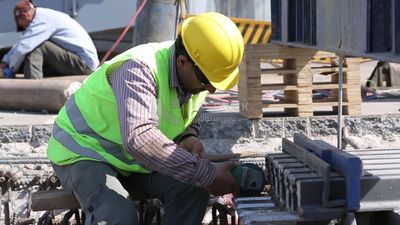 Welder in special clothes goggles safety helmets, steel welding, industrial worker