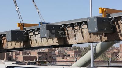 Group of engineers trying to put a part of a bridge to complete it, work, construction, engineering tools and equipment