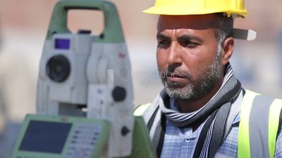 Two surveyor engineers with equipment on the road construction site, Civil Engineers, Surveyor equipment