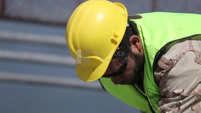 Welder in special clothes goggles safety helmets, steel welding, industrial worker