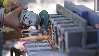 Welder in special clothes goggles safety helmets, steel welding, industrial worker