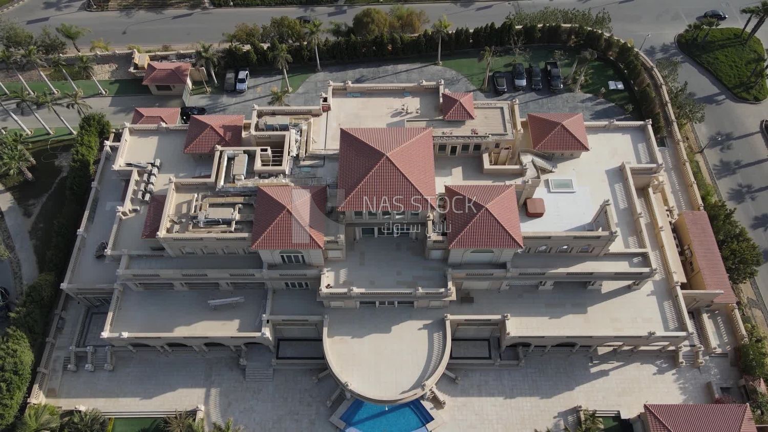 Drone footage of a palace with a swimming pool in Zayed, Egypt