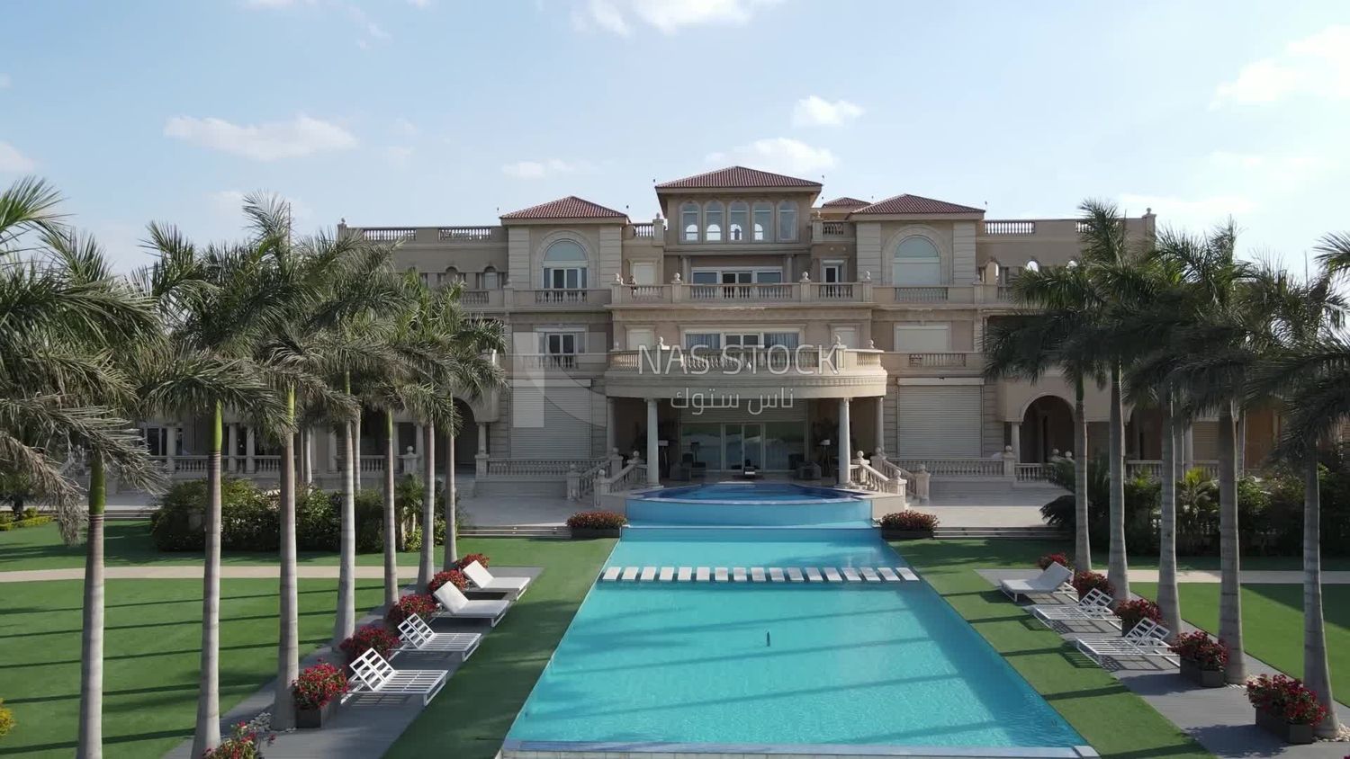 Drone footage of a palace with a swimming pool in Zayed, Egypt