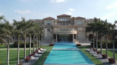 Drone footage of a palace with a swimming pool in Zayed, Egypt