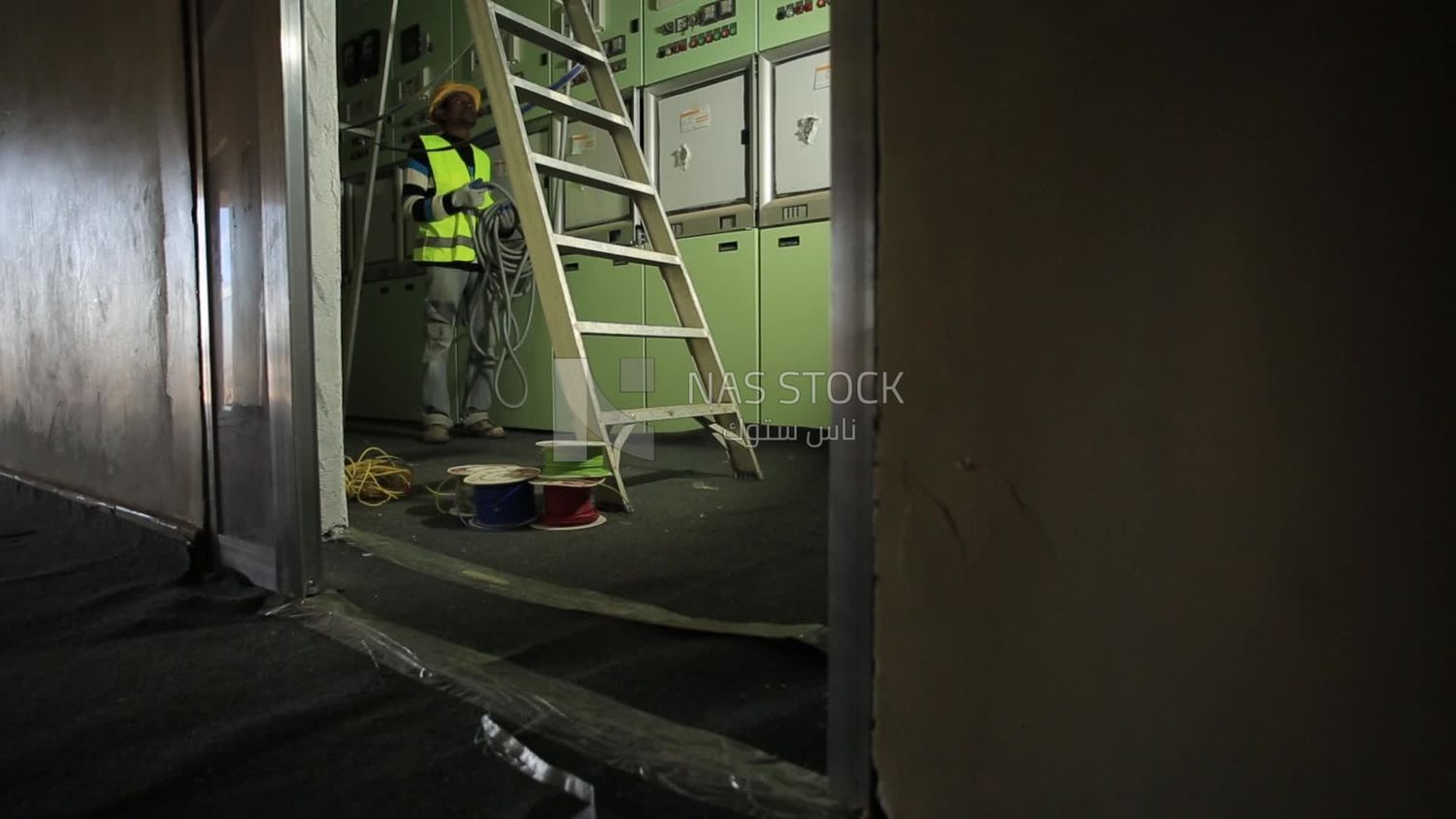 Man checking the electric wire of the ceiling