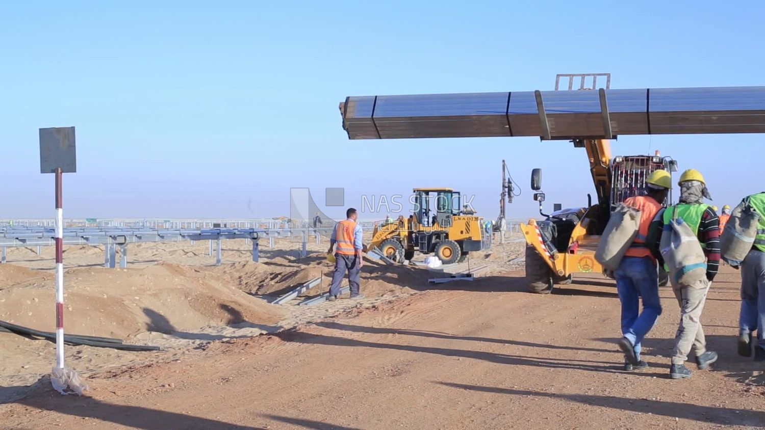 Man driving an excavator in solar energy