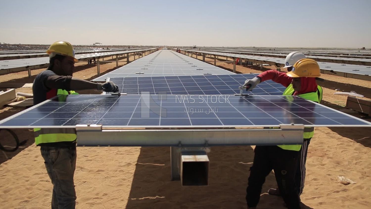 Group of men trying to prepare the site of the solar energy