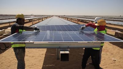 Group of men trying to prepare the site of the solar energy