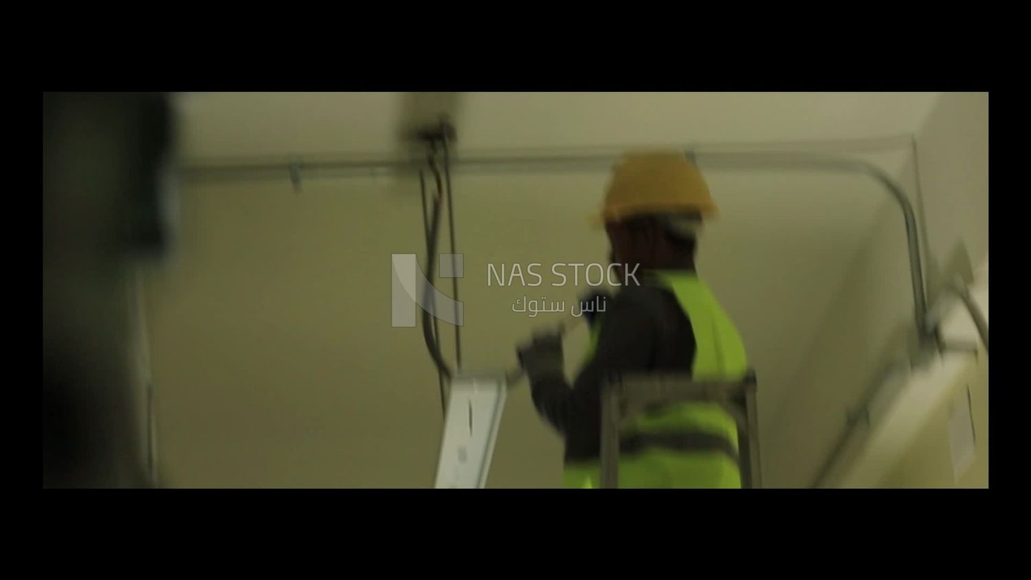 Man checking the electric wire of the ceiling