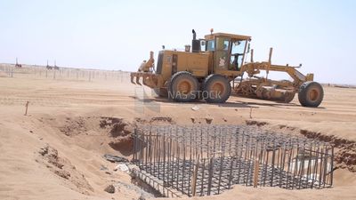 Man driving an excavator in solar energy