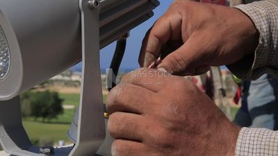 Man examines an electric wire, the use of maintenance tools and equipment